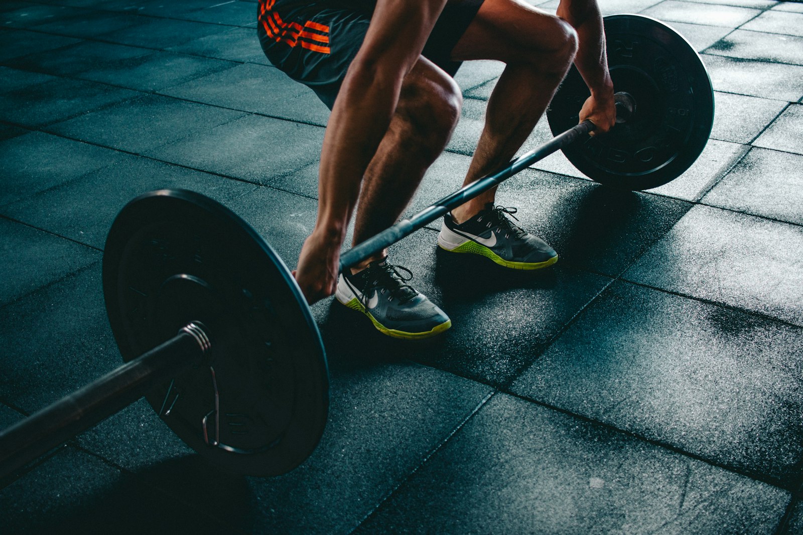 Athlete training with dumbbells